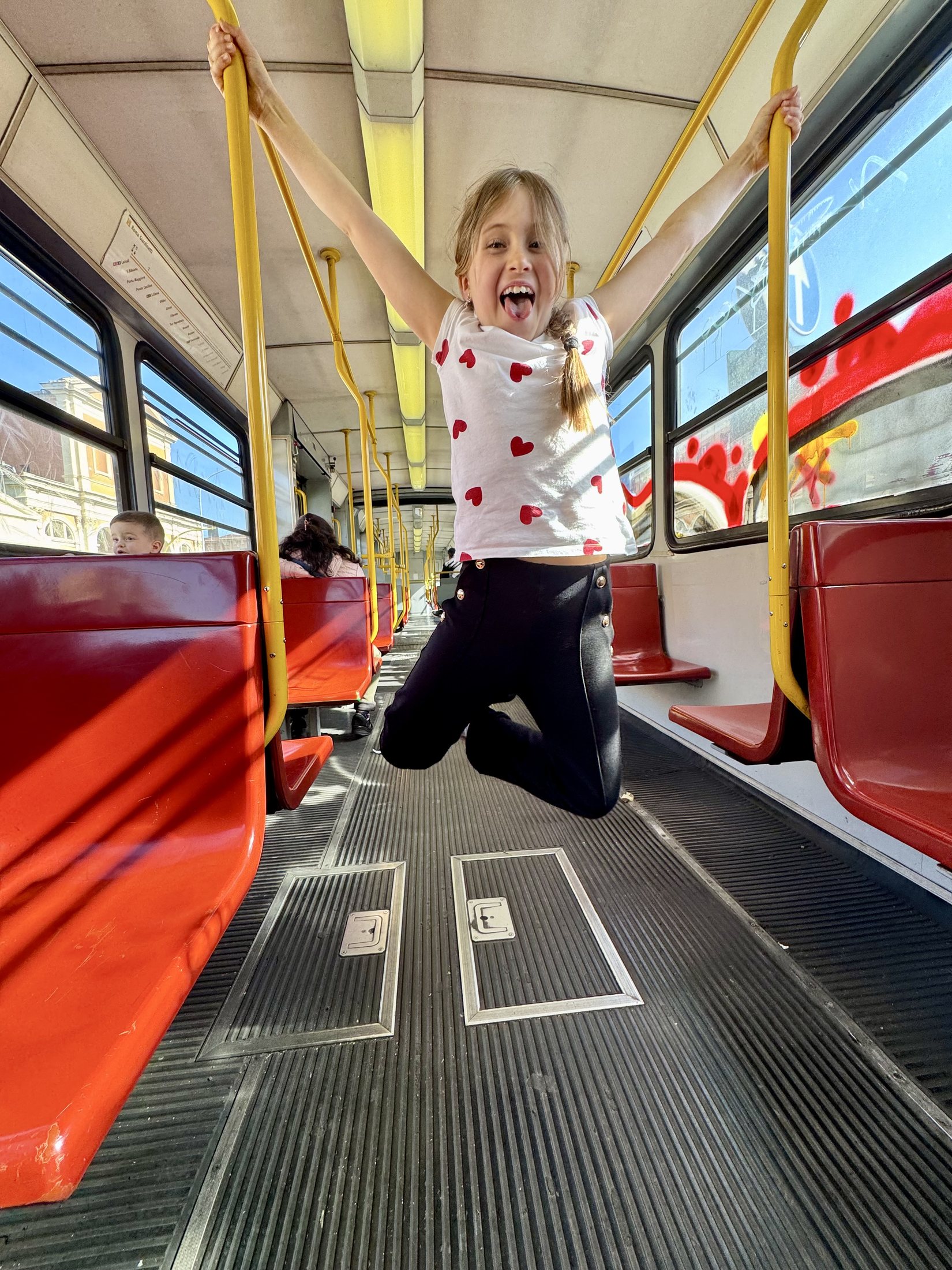 MaryEllen enjoying everyday family life on a tram in Rome